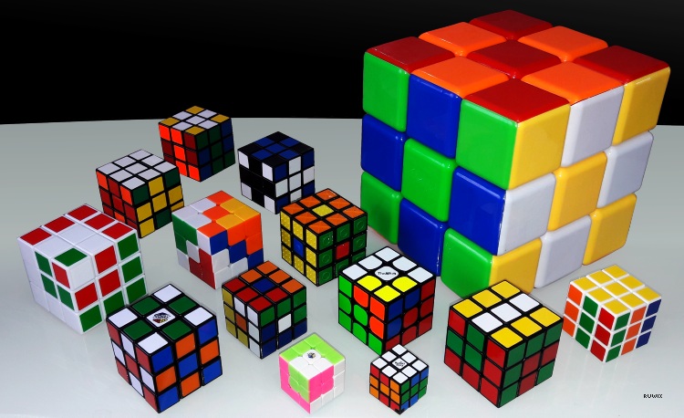 Many different rubik's cubes on a table